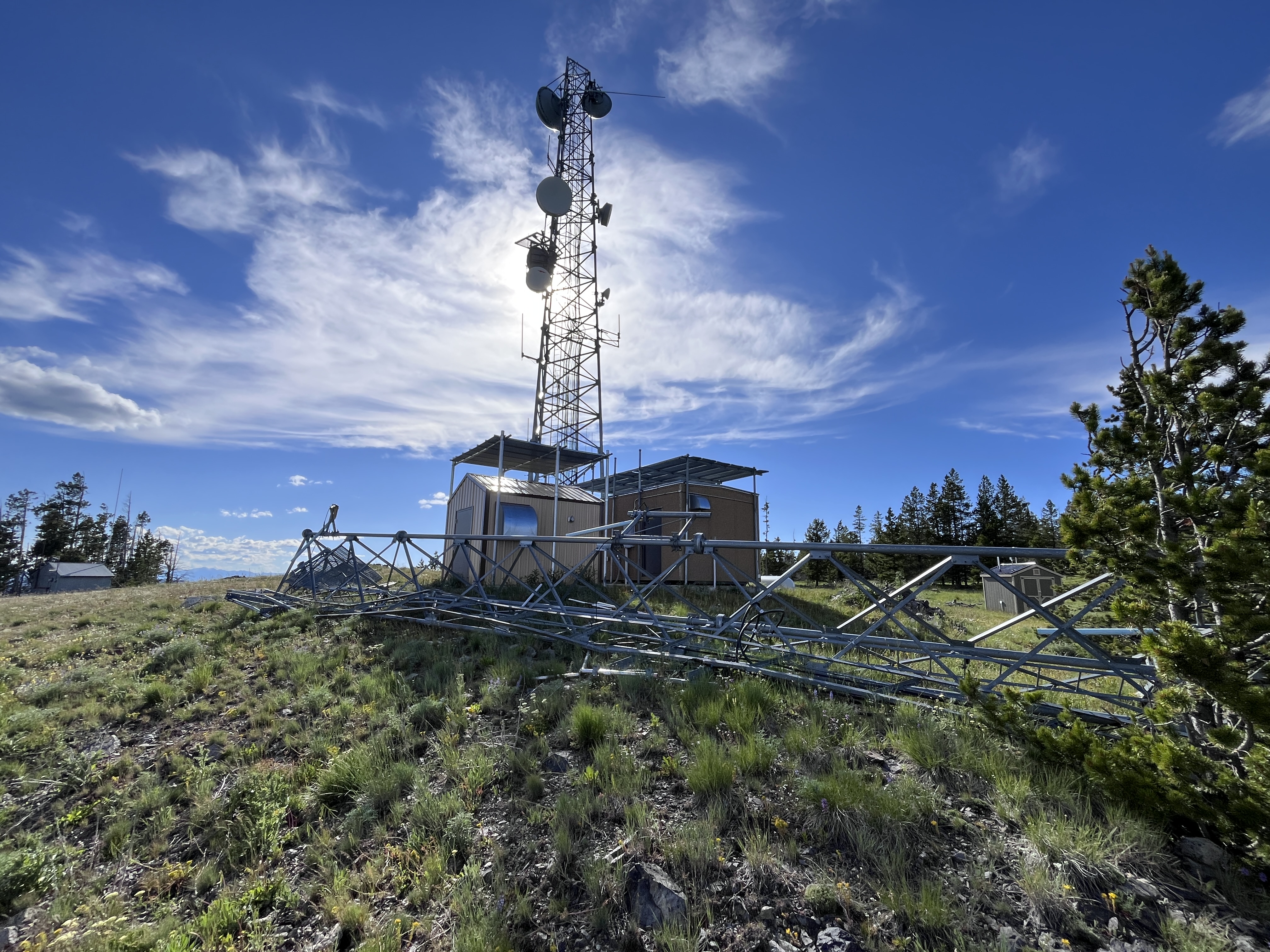 Wind-damaged tower near summit.